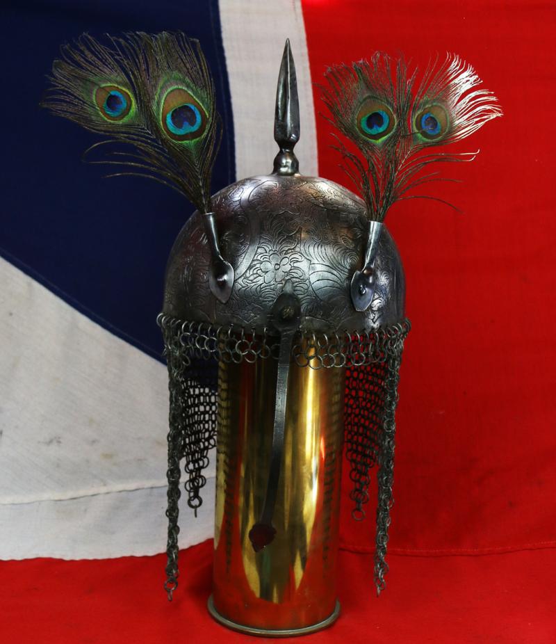 An Indian Kulah Khud Helmet With Fully Etched and Engraved With Exotic Birds and Figures. Mounted With the Traditional Spike & Peacock Feather Plume Mounts