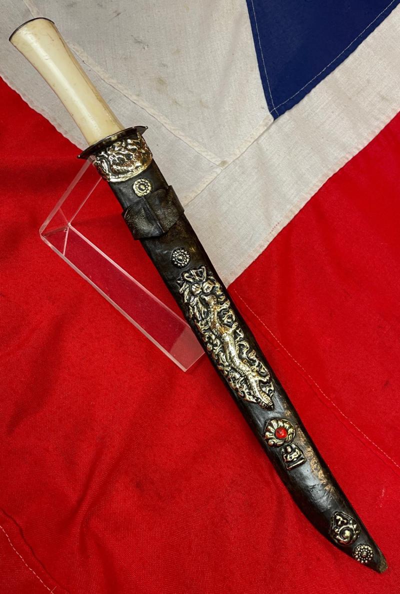 A Most Interesting & Unusual Form of Antique Tibetan Buddhist Large Dagger-Short Sword. A Dpa'dam. Decorated With Repousse Dragon and Buddha, Seated in the Padmasana Pose, in Dhyana Mudra, With Mandorla, a Coral Stone Bead Inset & Unalome Spiral Sun