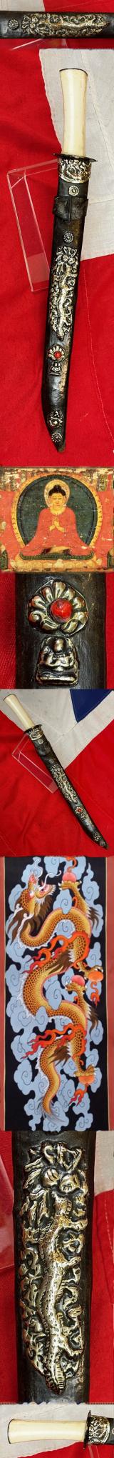 A Most Interesting & Unusual Form of Antique Tibetan Buddhist Large Dagger-Short Sword. A Dpa'dam. Decorated With Repousse Dragon and Buddha, Seated in the Padmasana Pose, in Dhyana Mudra, With Mandorla, a Coral Stone Bead Inset & Unalome Spiral Sun