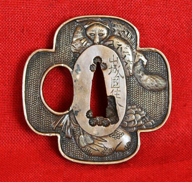A Superb Edo Period Umetada Tsuba Signed Yamashiro kuni ju Umetada Shigenari, From the Umetada Line Of Tsuba Makers of Yamashiro. Of A Carved Takebori Kitsune {Fox} Going To The Kitsune no Yomeiri {The Foxe's Wedding}