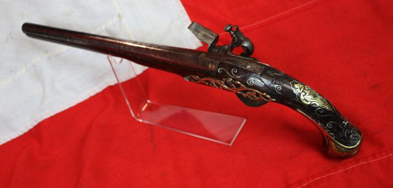 A Superb Corsair Pirate Captain’s Pistol. An I8th Century Long Flintlock, Italianate Style. Very Fine Quality Mounts and Engraving From The Mediterranean Region, as Used Throughout the Seven Seas From the Golden Age of Piracy.