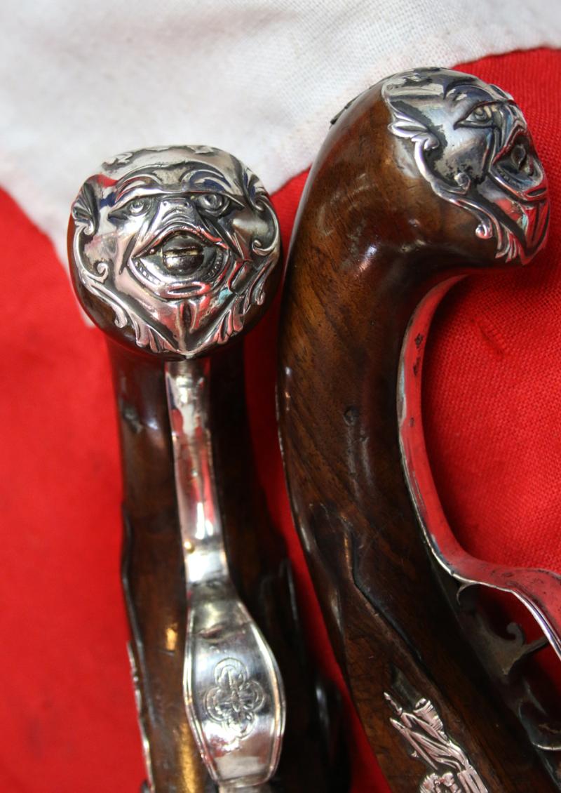 A Pair Of Finest Irish Silver Mounted Holster Pistols By John Govers Of Dame St. Dublin 1760. Finest Silver Cartouches Each One Engraved With The Original Owner, An Irish Duke's, Noble Crests, Of Irish Ducal Crowned Lions Passant, Set In Noble Shields