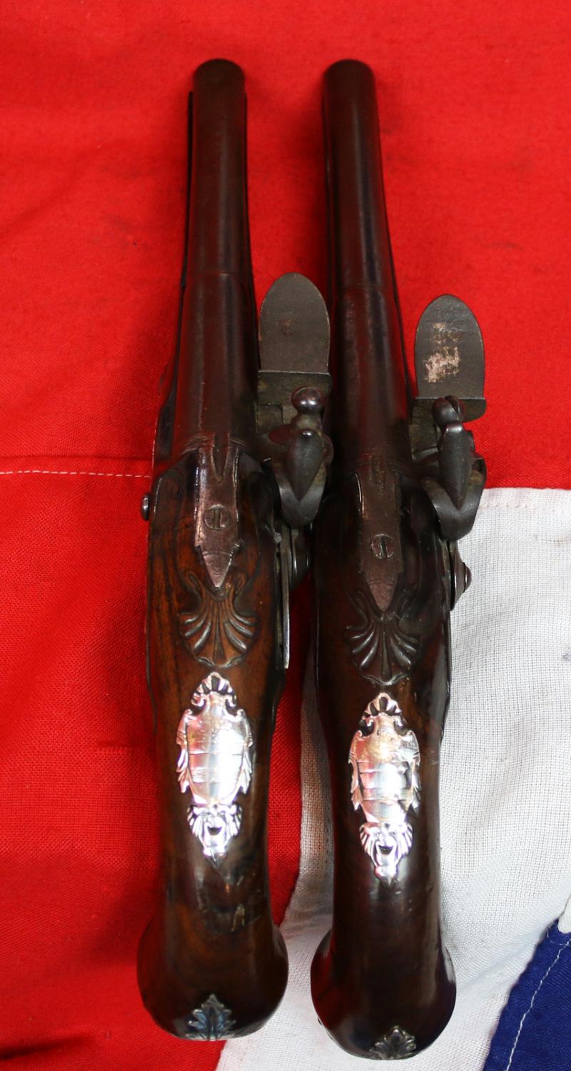A Pair Of Finest Irish Silver Mounted Holster Pistols By John Govers Of Dame St. Dublin 1760. Finest Silver Cartouches Each One Engraved With The Original Owner, An Irish Duke's, Noble Crests, Of Irish Ducal Crowned Lions Passant, Set In Noble Shields