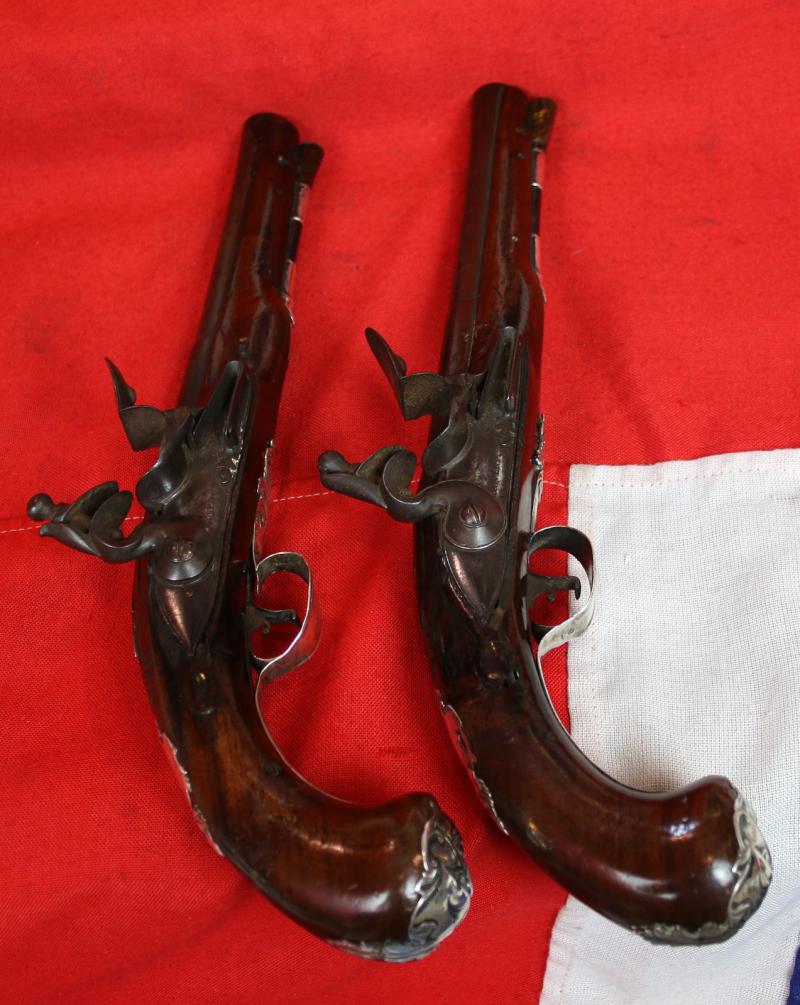 A Pair Of Finest Irish Silver Mounted Holster Pistols By John Govers Of Dame St. Dublin 1760. Finest Silver Cartouches Each One Engraved With The Original Owner, An Irish Duke's, Noble Crests, Of Irish Ducal Crowned Lions Passant, Set In Noble Shields