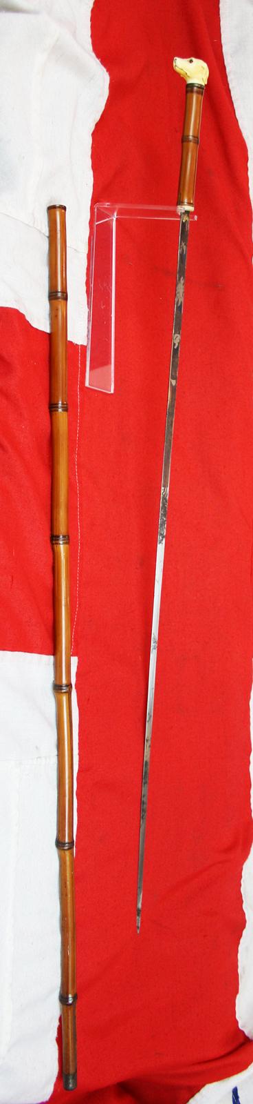 A Fine, Original, 19th Century Antique, King George IIIrd Carved Hound's Head Long Bladed Swordstick. Carved Ivory Head & Blue and Gilt Finely Engraved Steel Blade. Finest Quality Bamboo Handle and Haft