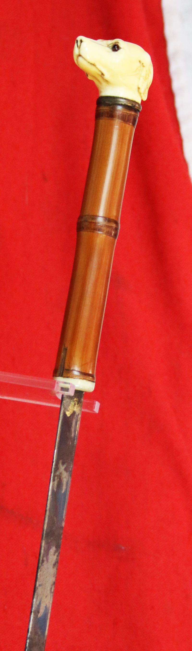 A Fine, Original, 19th Century Antique, King George IIIrd Carved Hound's Head Long Bladed Swordstick. Carved Ivory Head & Blue and Gilt Finely Engraved Steel Blade. Finest Quality Bamboo Handle and Haft