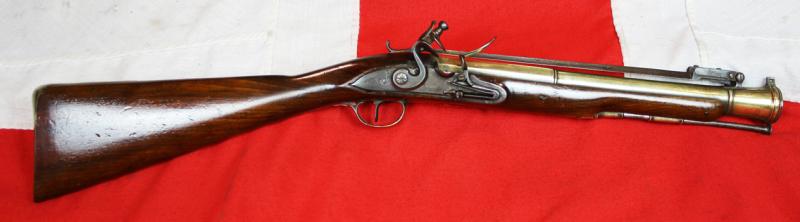 A Superb Royal Naval, Brass Cannon Barrel Blunderbuss With Finest 'Juglans Regia' Walnut Stock Spring Bayonet, Elaborately Engraved All Brass Furniture, by Daykin of Nottingham