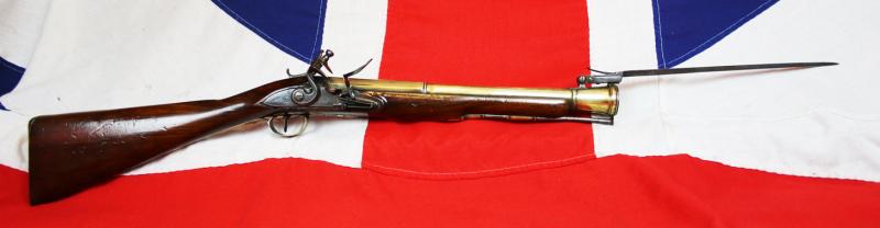 A Superb Royal Naval, Brass Cannon Barrel Blunderbuss With Finest 'Juglans Regia' Walnut Stock Spring Bayonet, Elaborately Engraved All Brass Furniture, by Daykin of Nottingham